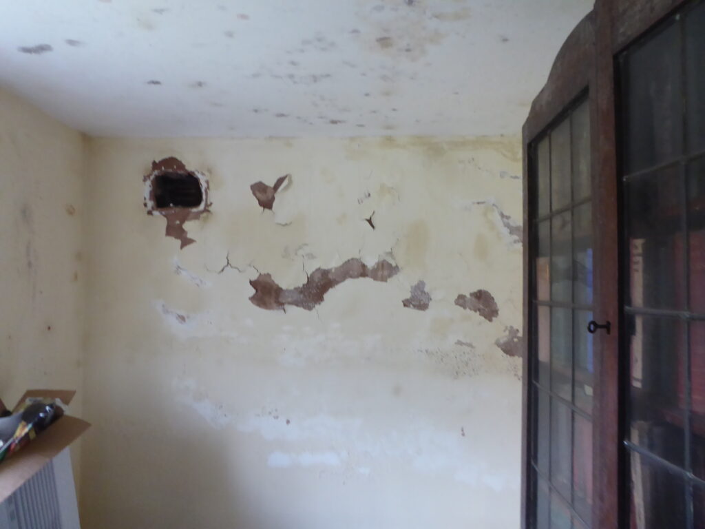 Badly damaged wall from condensation